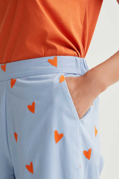 Pantalón estampado corazones naranja