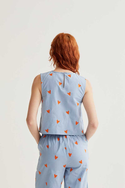 Top estampado corazones naranja