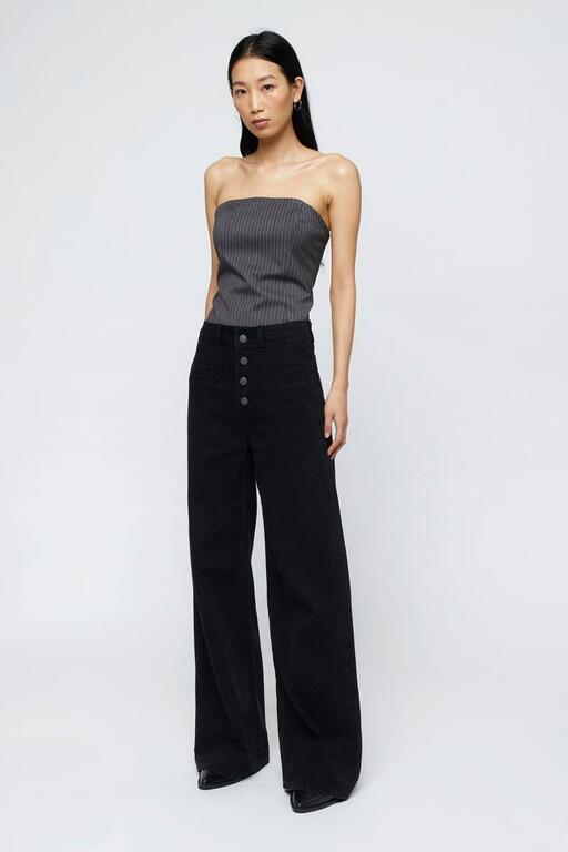 Jeans recto tiro alto negro Wild Pony con diseño de botones frontales y corte holgado, ideales para mujer. Estilo moderno y versátil.