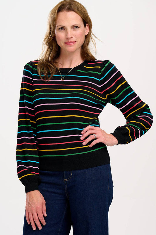 Jersey Madelin de Sugar Hill Brighton en color negro con estampado de rayas multicolor y estrellas. Diseño de manga larga y tejido de viscosa y algodón.