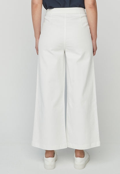 Pantalón Ayaori Unique blanco de corte amplio con botones laterales, ideal para un look sofisticado y relajado en primavera-verano.