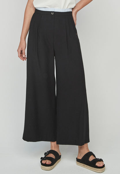 Pantalon Rasen Unique ancho negro de tiro alto, moderno y elegante. Diseño fluido con cintura alta que estiliza la silueta, ideal para primavera-verano.