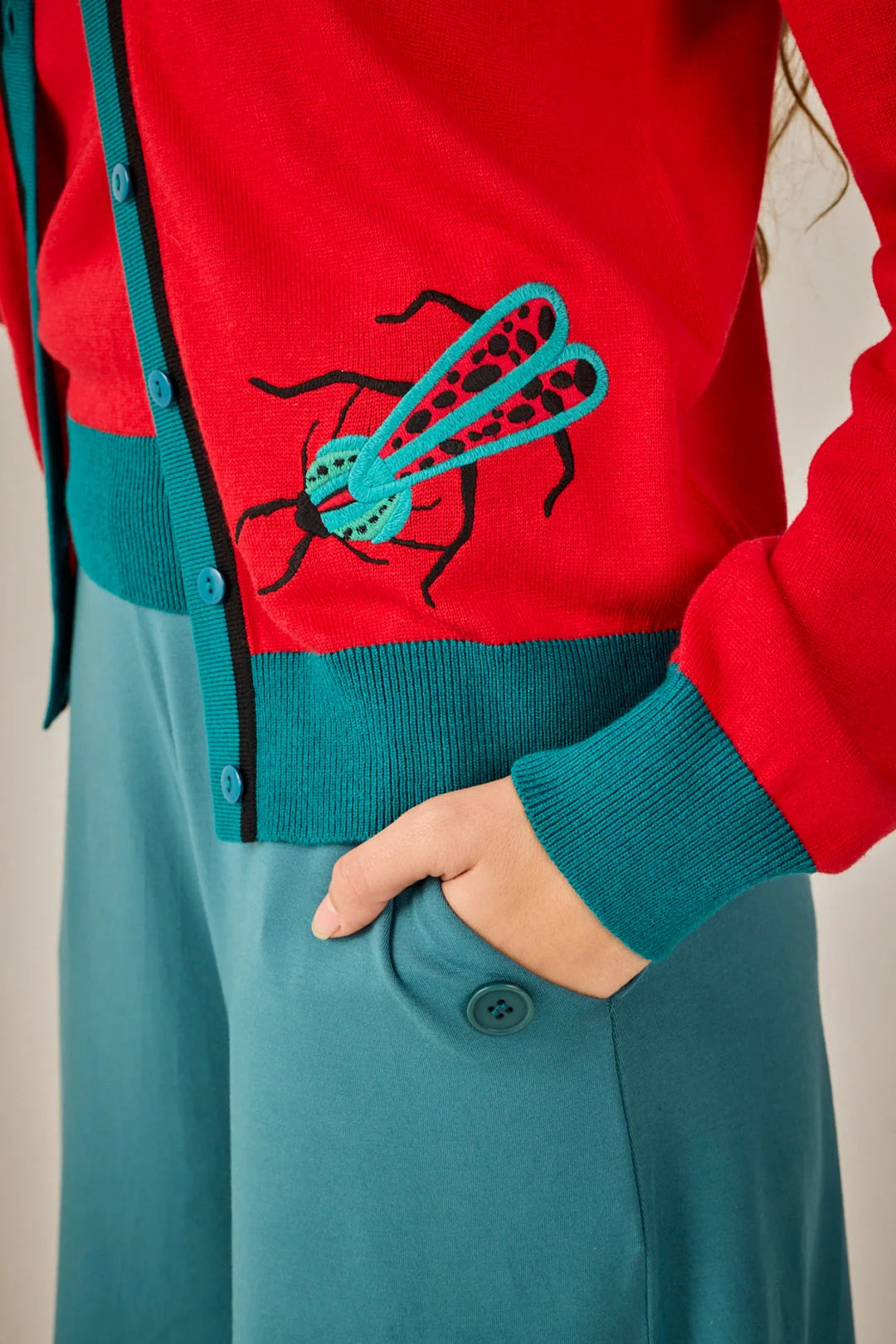 Conjunto de punto de dos piezas rojo y turquesa